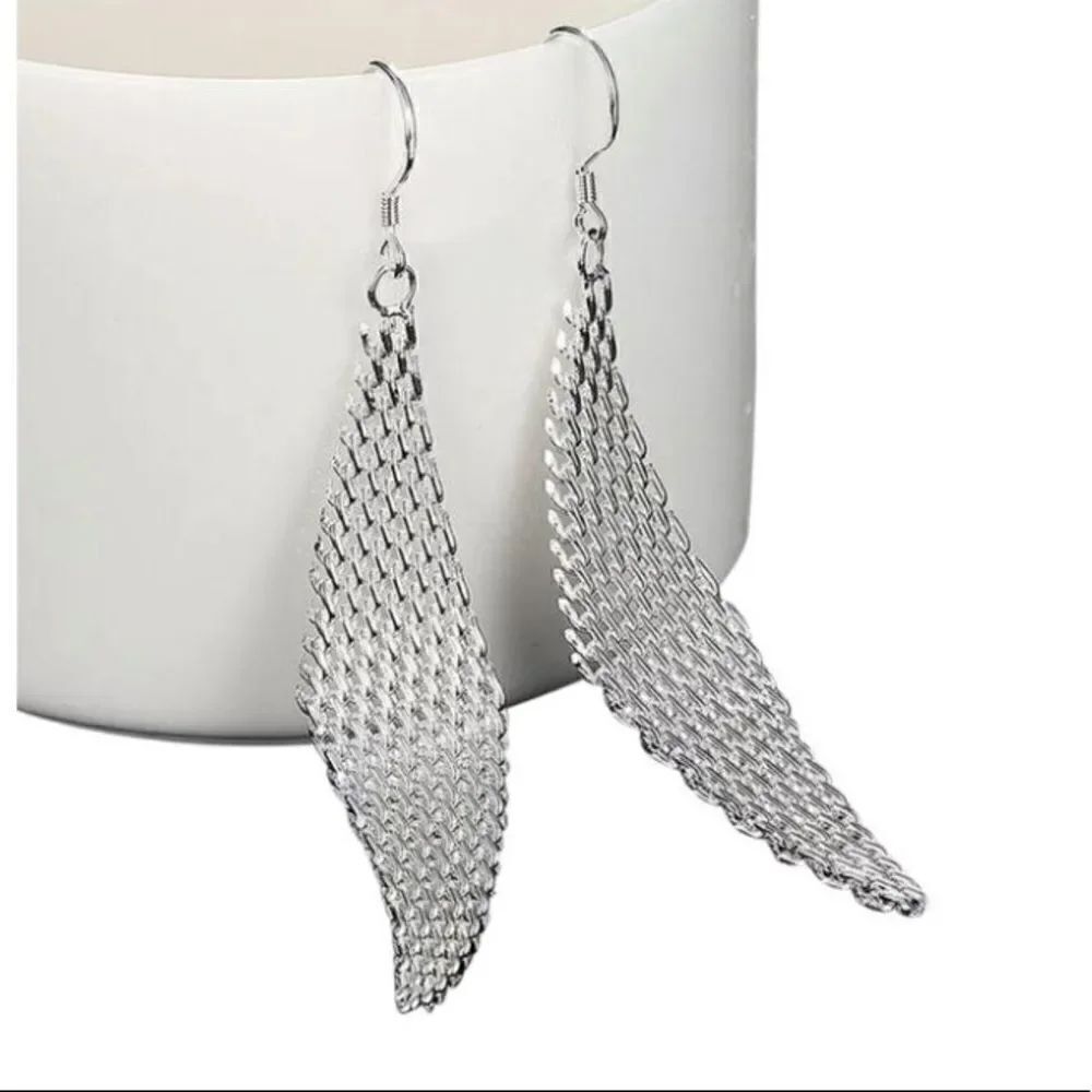 The Disco Queen Mesh Tibetan Silver trapezoid drop earring.